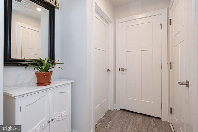 doorway to outside featuring light wood-style floors and visible vents