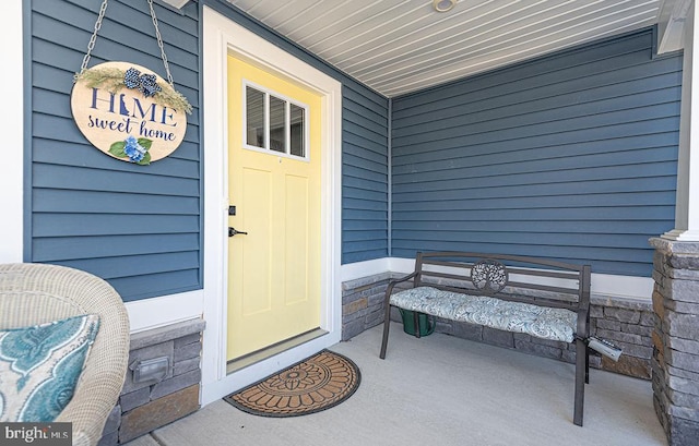 view of exterior entry featuring a porch