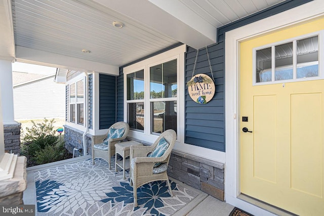 doorway to property featuring a porch