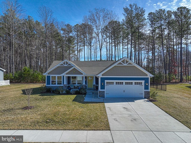 craftsman inspired home featuring a garage, concrete driveway, a front lawn, and a porch