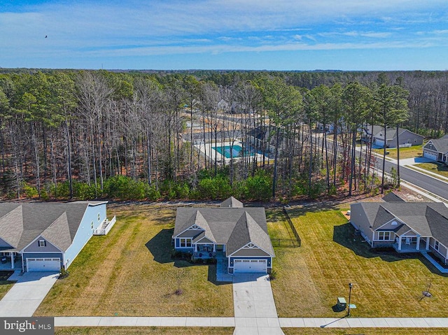 drone / aerial view featuring a view of trees