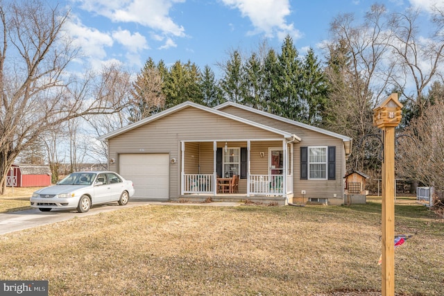 view of front facade with driveway, covered porch, a garage, and a front yard