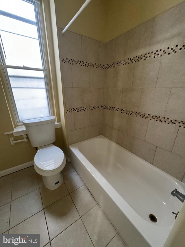 full bath featuring  shower combination, baseboards, toilet, and tile patterned floors