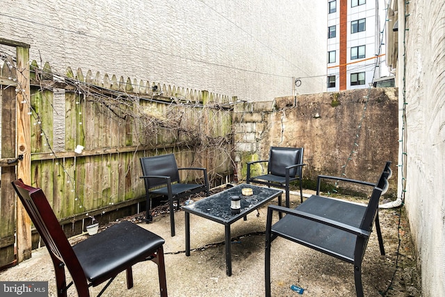 view of patio / terrace featuring fence