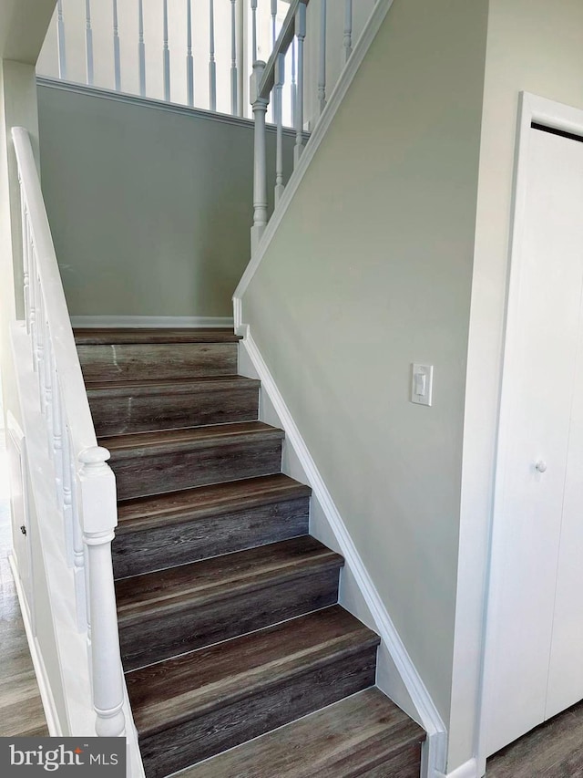 stairway with wood finished floors