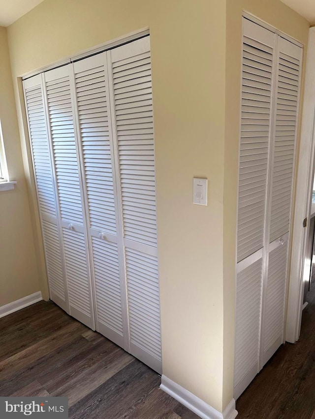 room details featuring baseboards and wood finished floors