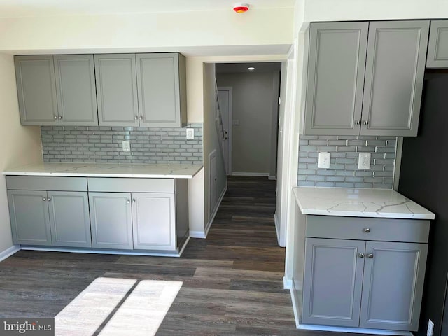 kitchen with dark wood finished floors and gray cabinetry