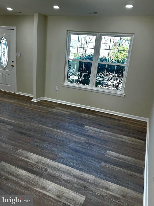 foyer entrance with recessed lighting, baseboards, and wood finished floors