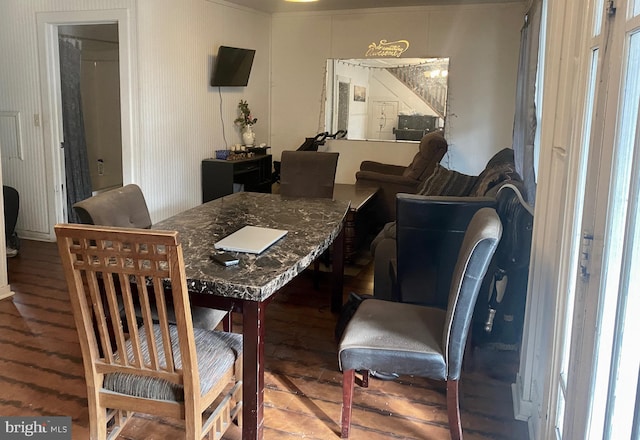 dining space featuring wood finished floors