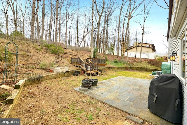 view of yard with an outdoor fire pit and a patio area