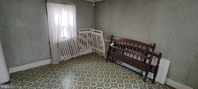 bedroom featuring multiple windows and baseboards