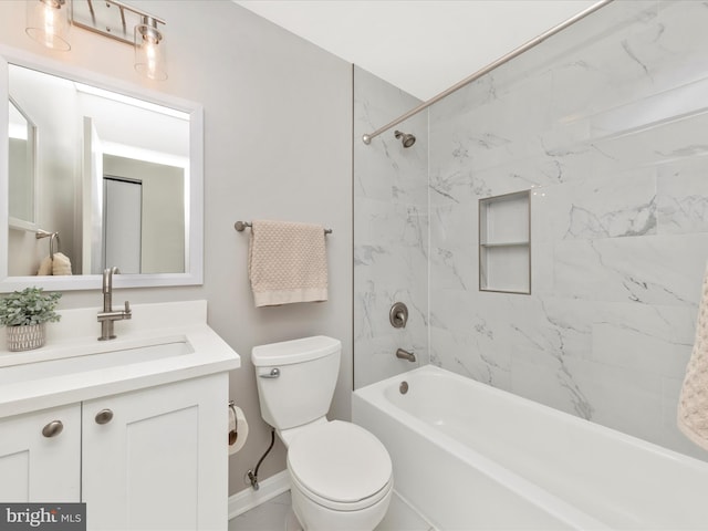 bathroom with baseboards, shower / bath combination, vanity, and toilet