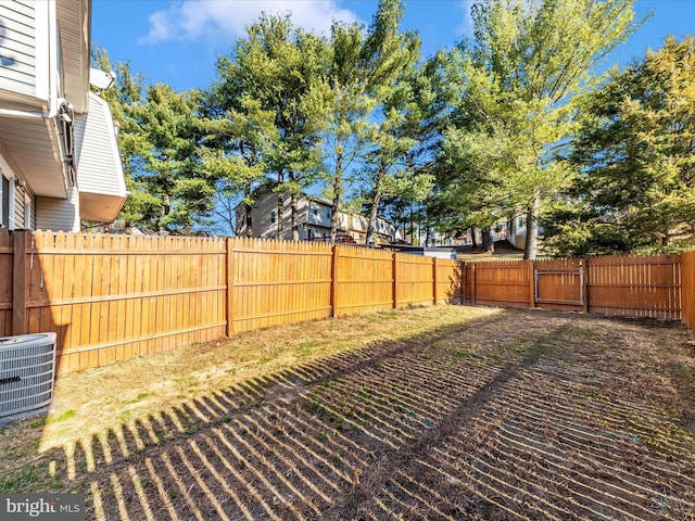 view of yard featuring a fenced backyard and cooling unit