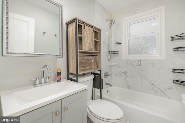 bathroom featuring toilet, tub / shower combination, and vanity