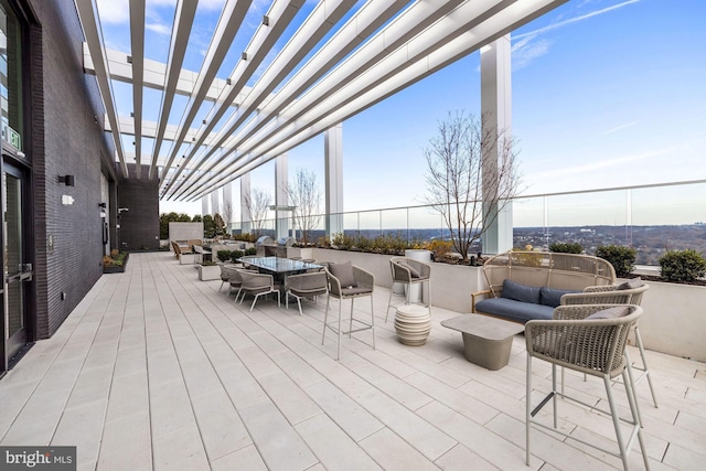 view of patio / terrace featuring outdoor dining space, outdoor lounge area, and a pergola