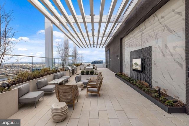 view of patio / terrace featuring a pergola and an outdoor hangout area