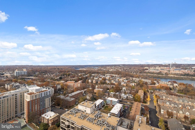 birds eye view of property with a water view and a city view