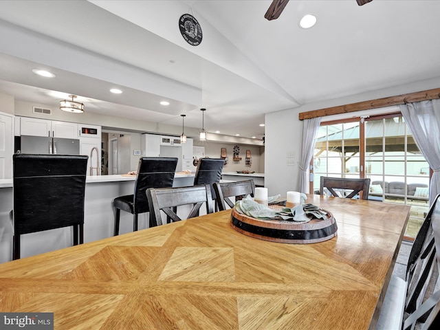 dining room with ceiling fan, lofted ceiling, visible vents, and recessed lighting