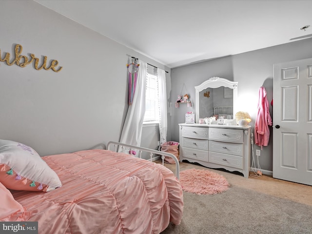 bedroom featuring carpet