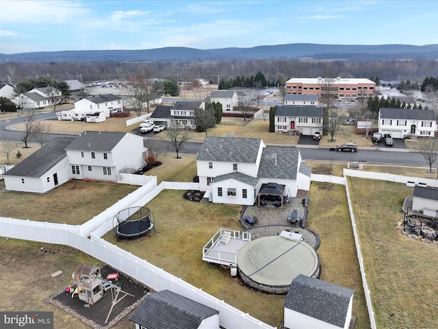 drone / aerial view with a residential view and a mountain view