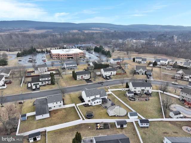 birds eye view of property featuring a mountain view