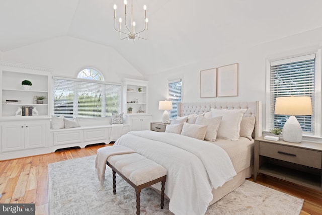 506 Ivy Cir, Alexandria, VA 22302 - bedroom with light wood-style flooring, a chandelier, and lofted ceiling
