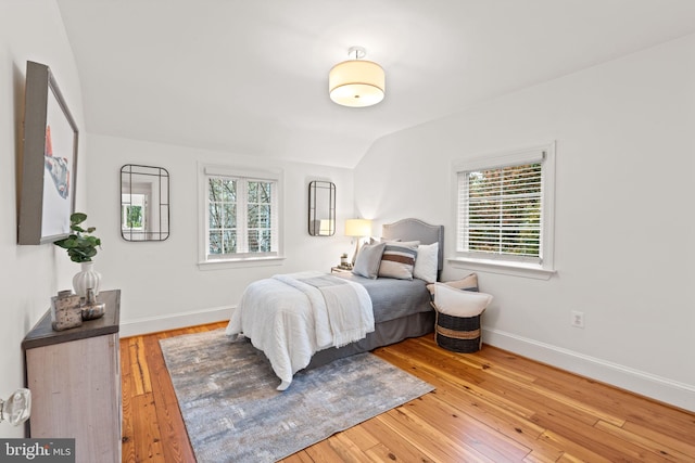 506 Ivy Cir, Alexandria, VA 22302 - bedroom with wood-type flooring, baseboards, and lofted ceiling
