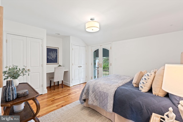 506 Ivy Cir, Alexandria, VA 22302 - bedroom with baseboards, access to exterior, multiple closets, arched walkways, and light wood finished floors