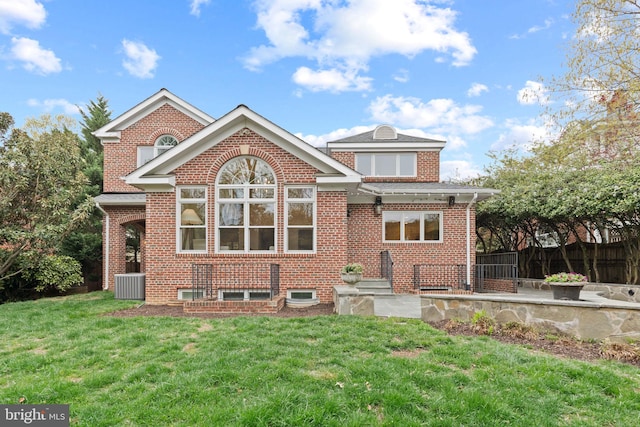 506 Ivy Cir, Alexandria, VA 22302 - rear view of house with cooling unit, a yard, a patio area, and brick siding