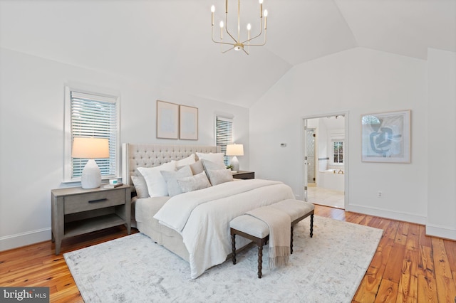 506 Ivy Cir, Alexandria, VA 22302 - bedroom with baseboards, light wood finished floors, an inviting chandelier, and vaulted ceiling