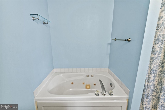 bathroom with a whirlpool tub