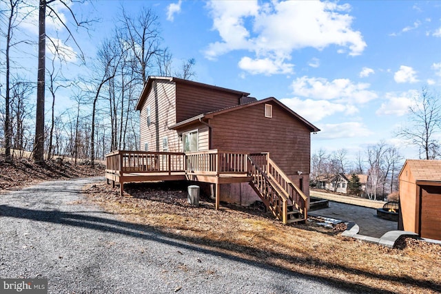 view of home's exterior featuring a deck