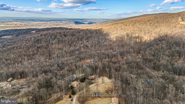 birds eye view of property with a forest view