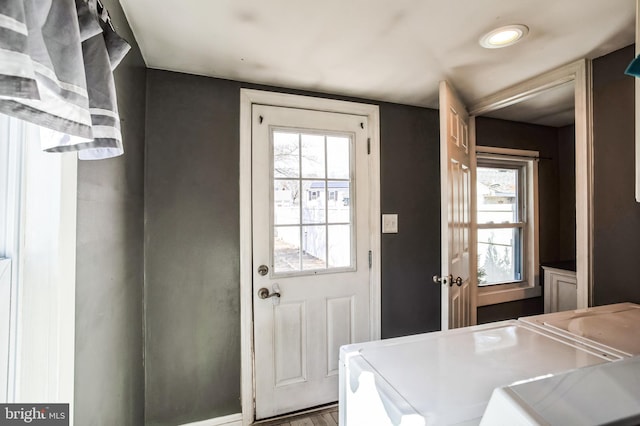 doorway with separate washer and dryer