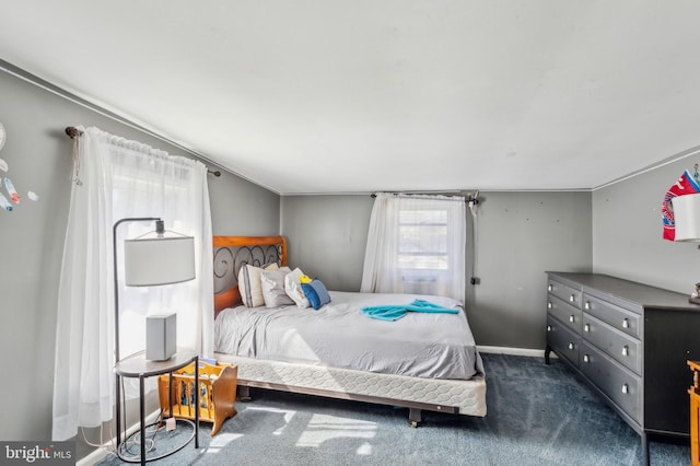 carpeted bedroom featuring baseboards