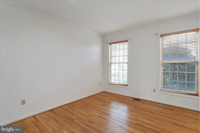461 Apple Cross Rd, Harpers Ferry, WV 25425 - empty room featuring baseboards, ornamental molding, visible vents, and light wood-style flooring