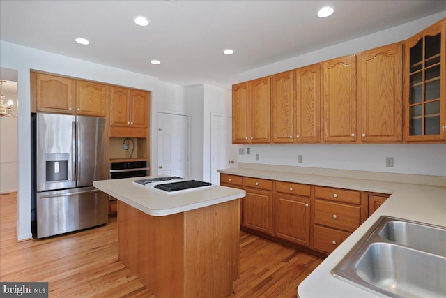 461 Apple Cross Rd, Harpers Ferry, WV 25425 - kitchen with a center island, a sink, light wood-type flooring, white gas stovetop, and stainless steel refrigerator with ice dispenser