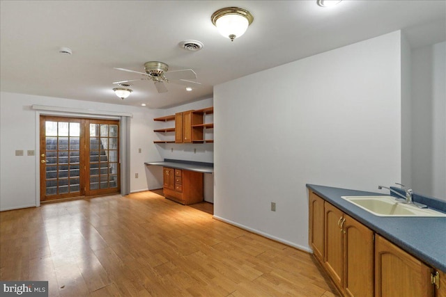 461 Apple Cross Rd, Harpers Ferry, WV 25425 - kitchen with brown cabinetry, a sink, and visible vents
