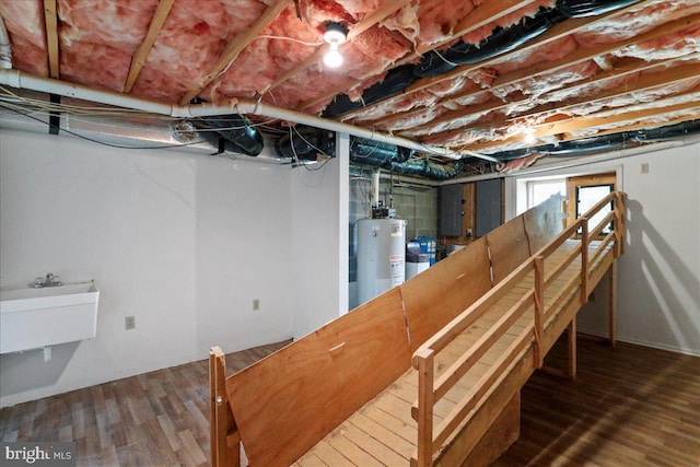 461 Apple Cross Rd, Harpers Ferry, WV 25425 - basement featuring wood finished floors, a sink, and gas water heater
