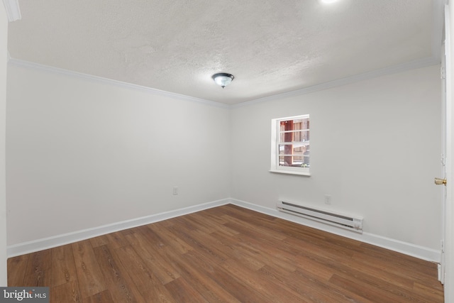 unfurnished room with baseboards, a textured ceiling, wood finished floors, and a baseboard radiator