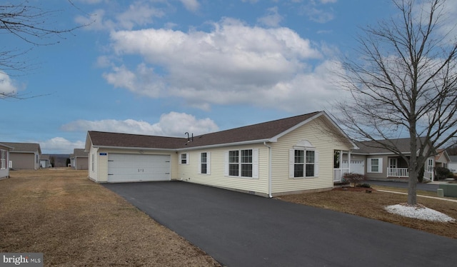 view of front of home with a garage and driveway