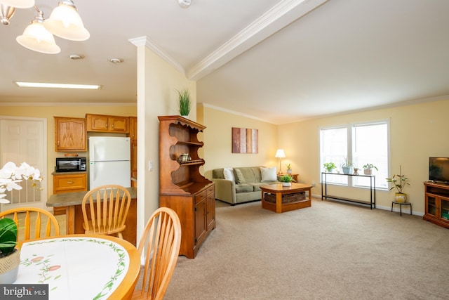 dining space with light colored carpet, crown molding, baseboards, and an inviting chandelier