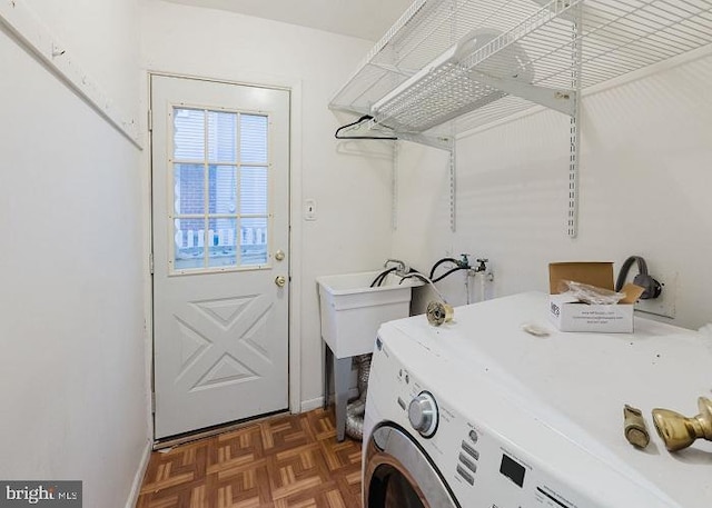 laundry room with washer / dryer, laundry area, and baseboards