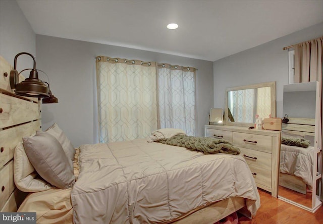 bedroom featuring light wood-style flooring