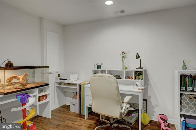 office with recessed lighting, visible vents, and wood finished floors