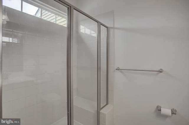 full bath with a shower stall