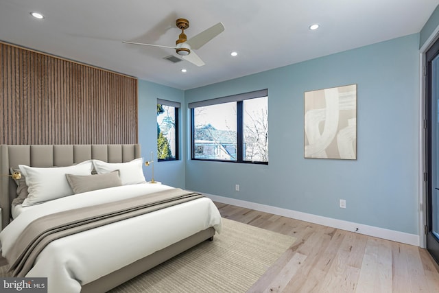 bedroom with ceiling fan, recessed lighting, visible vents, baseboards, and light wood-type flooring