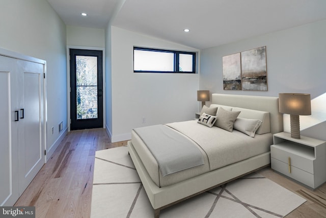 bedroom with light wood-type flooring, baseboards, vaulted ceiling, and recessed lighting