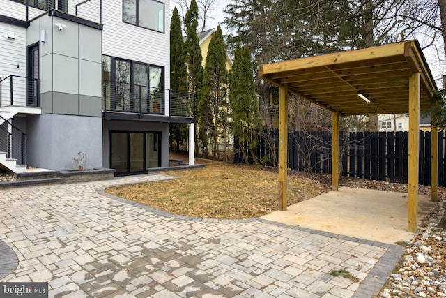 view of patio / terrace featuring fence