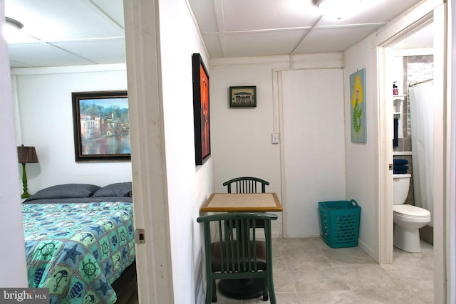 bedroom featuring a paneled ceiling